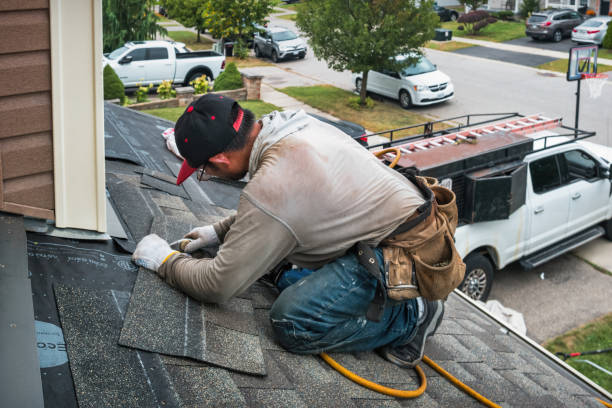 Professional Flat Roof Repair technician working in Olin, IA